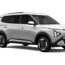 Kia Carens Clavis EV at a charging station in a futuristic city – autoakhbar.com