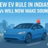 Blue electric vehicle emitting sound waves on a city road, highlighting India's new EV sound regulation