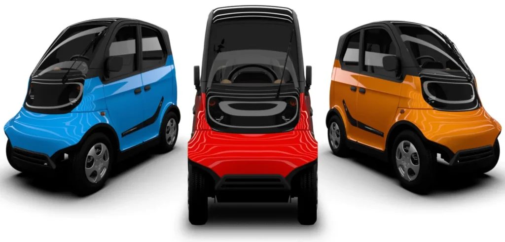 Executives unveiling Wings Robin Electric Car at launch event in India