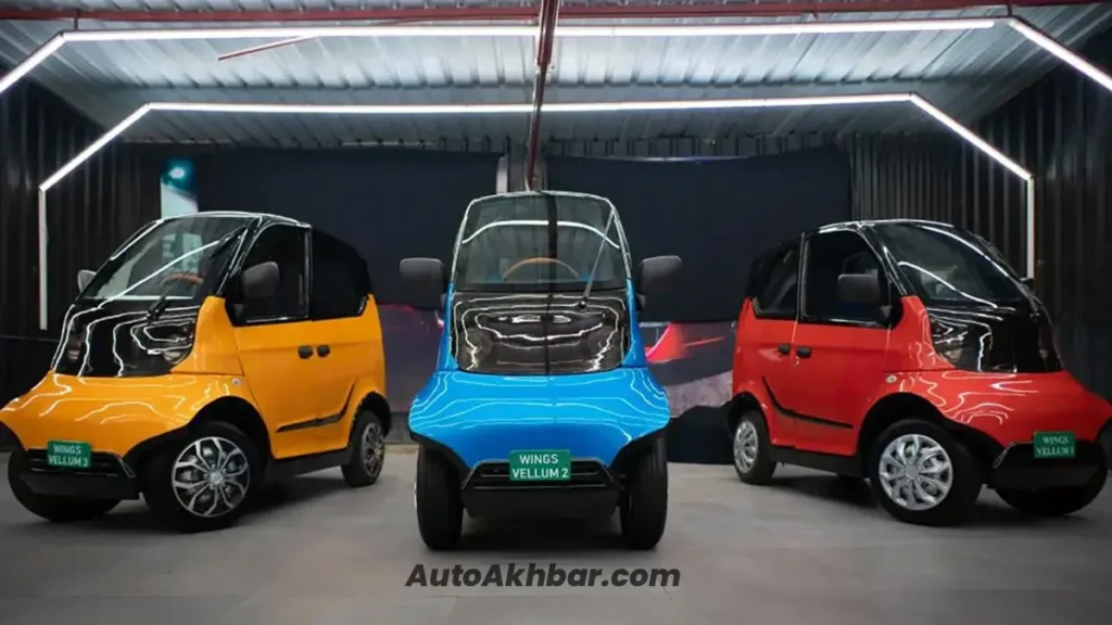 Executives unveiling Wings Robin Electric Car at launch event in India