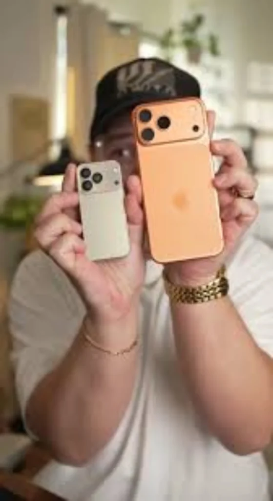Shocked man looking at iPhone 17 Pro Max and Mini iPhone 17 Pro Max concept
