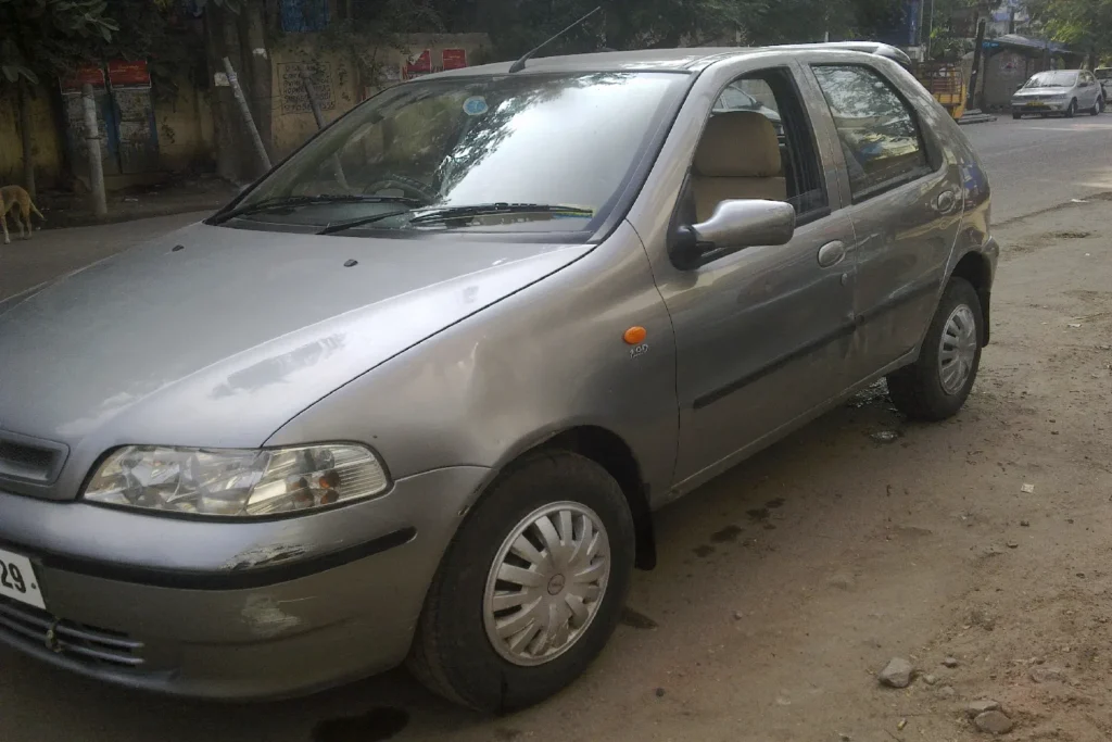 Old Fiat Palio hatchback parked outdoors, showcasing classic Fiat design and strong build quality