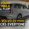 Rear view of upgraded 2026 Volvo EX90 electric SUV in a showroom with AutoAkhbar branding.