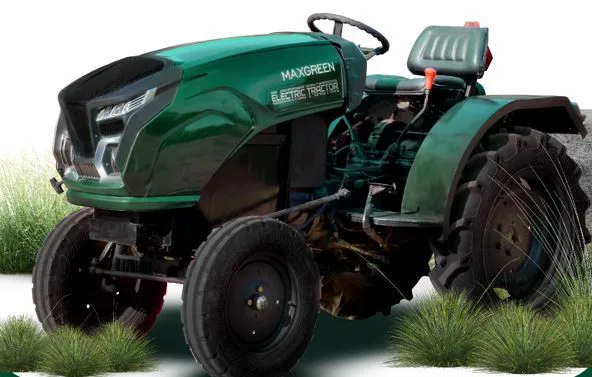 Workers standing with the Maxgreen Electric Tractor in front of the company board for the Maxgreen EV tractor review.