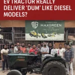 Workers standing with the Maxgreen Electric Tractor in front of the company board for the Maxgreen EV tractor review.
