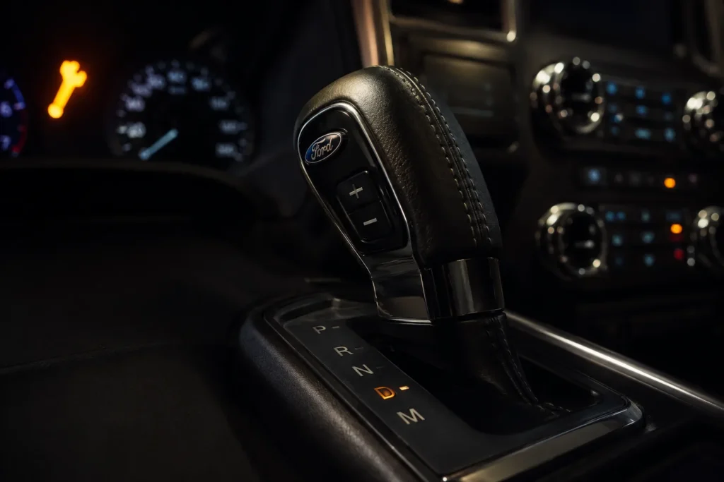 Ford F-150 gear shifter with park system warning light on dashboard — transmission park issue recall 2026