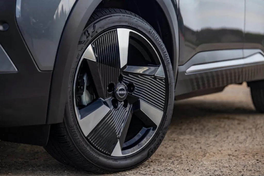 Close-up of a yellow brake caliper on a Nissan GT-R wheel Grey