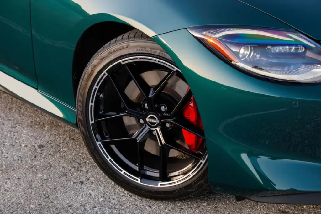 Close-up of a yellow brake caliper on a Nissan GT-R wheel Red