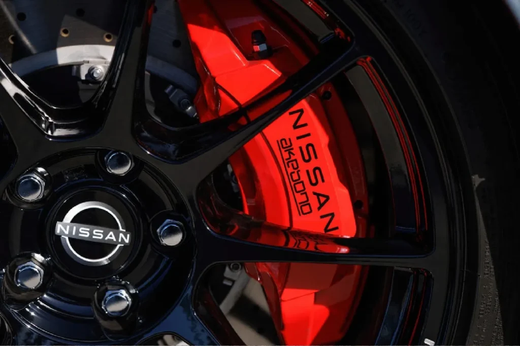 Close-up of a yellow brake caliper on a Nissan GT-R wheel Bright Red