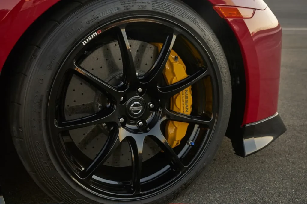 Close-up of a yellow brake caliper on a Nissan GT-R wheel Yellow