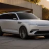Genesis GV90 flagship electric SUV parked outdoors at sunset
