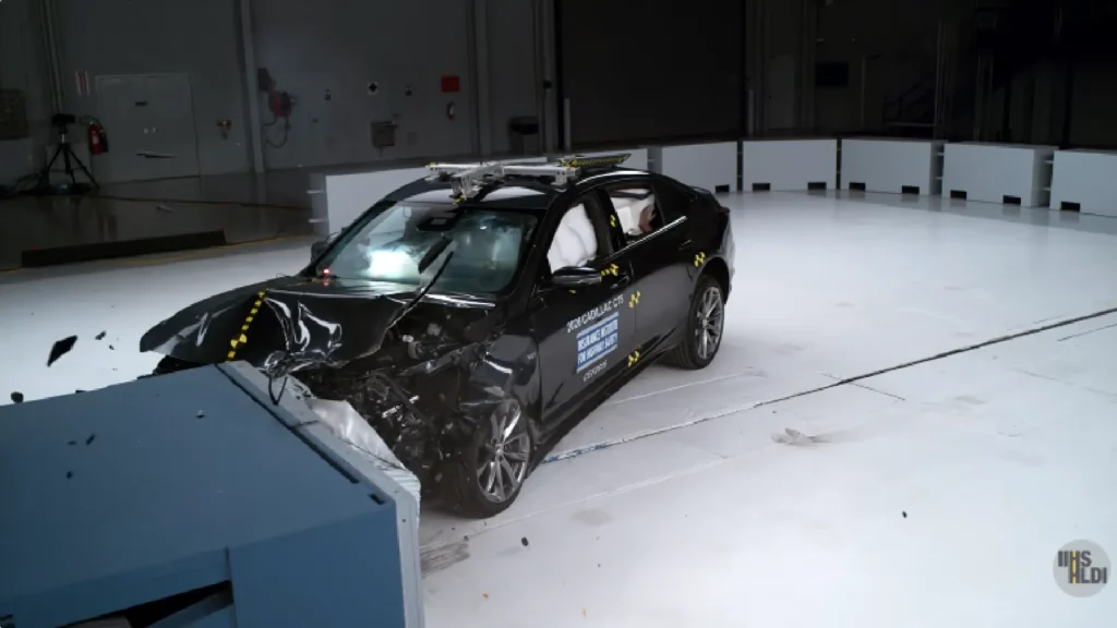 2026 Cadillac CT5 luxury sedan side profile in crash test facility
