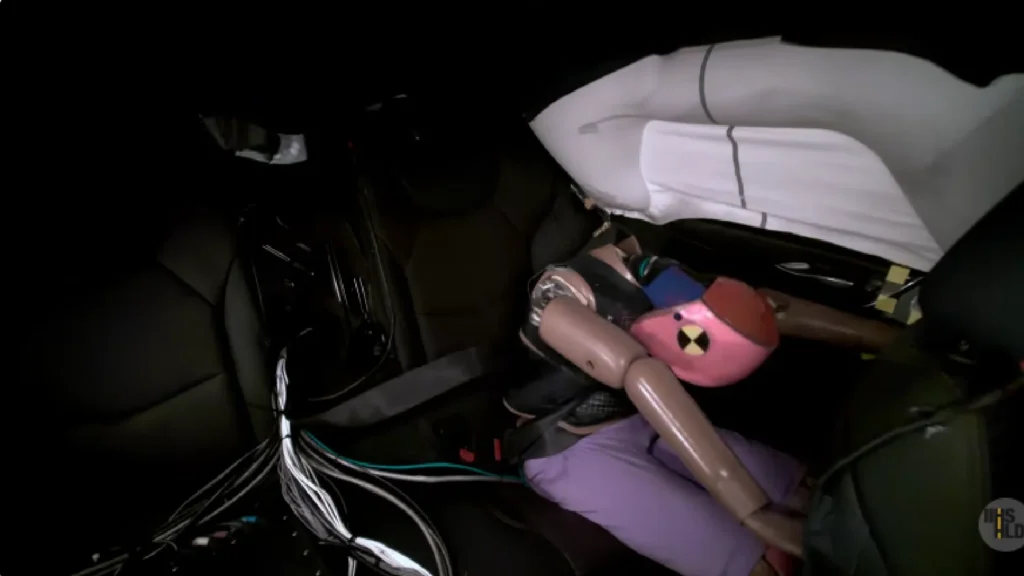 2026 Cadillac CT5 luxury sedan side profile in crash test facility