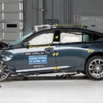 2026 Cadillac CT5 luxury sedan side profile in crash test facility