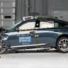 2026 Cadillac CT5 luxury sedan side profile in crash test facility