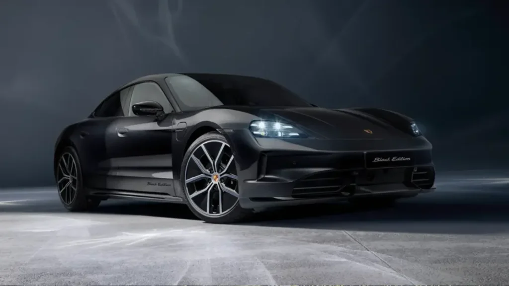 2026 Porsche Taycan 4 electric sedan on a city street at dusk, AutoAkhbar branded image