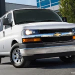 2027 Chevrolet Express van exterior shot, AutoAkhbar.com branded image