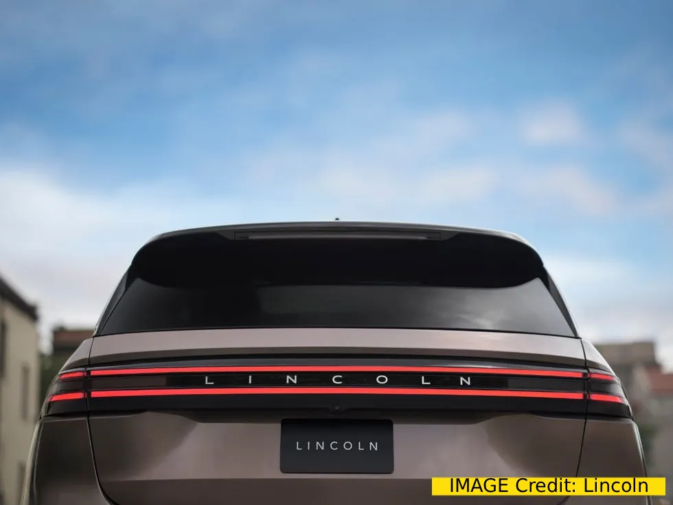 2027 Lincoln Nautilus SUV on a coastal road at golden hour (2)