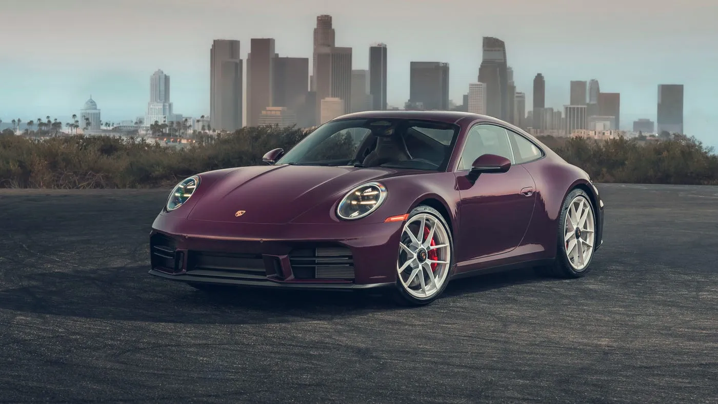 2027 Porsche 911 Carrera S with manual MT Package driving on a mountain road