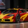 1996 McLaren F1 GTR race car displayed ahead of a classic car auction
