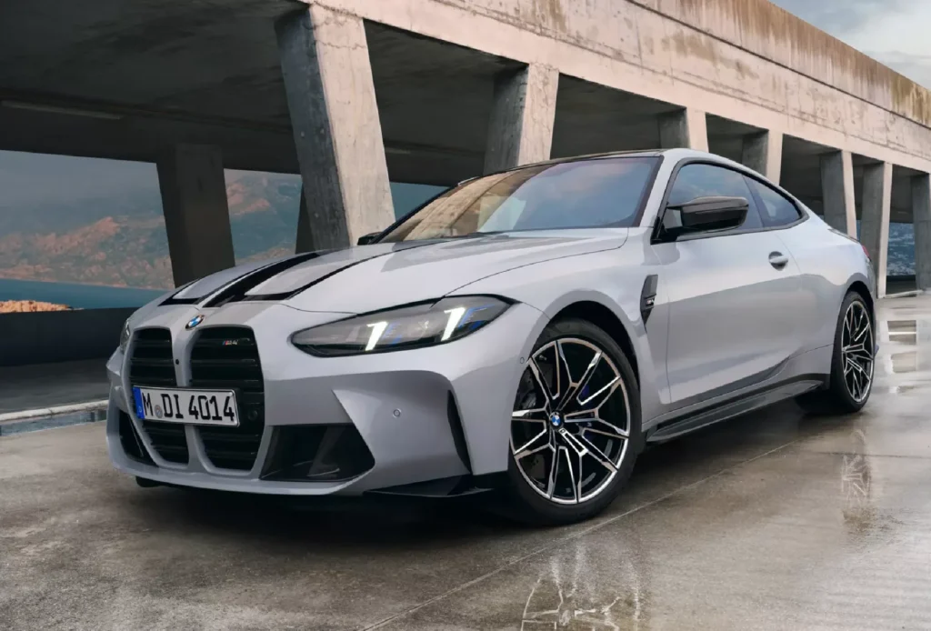 BMW 5 Series sedan being inspected by a technician for the driveshaft recall