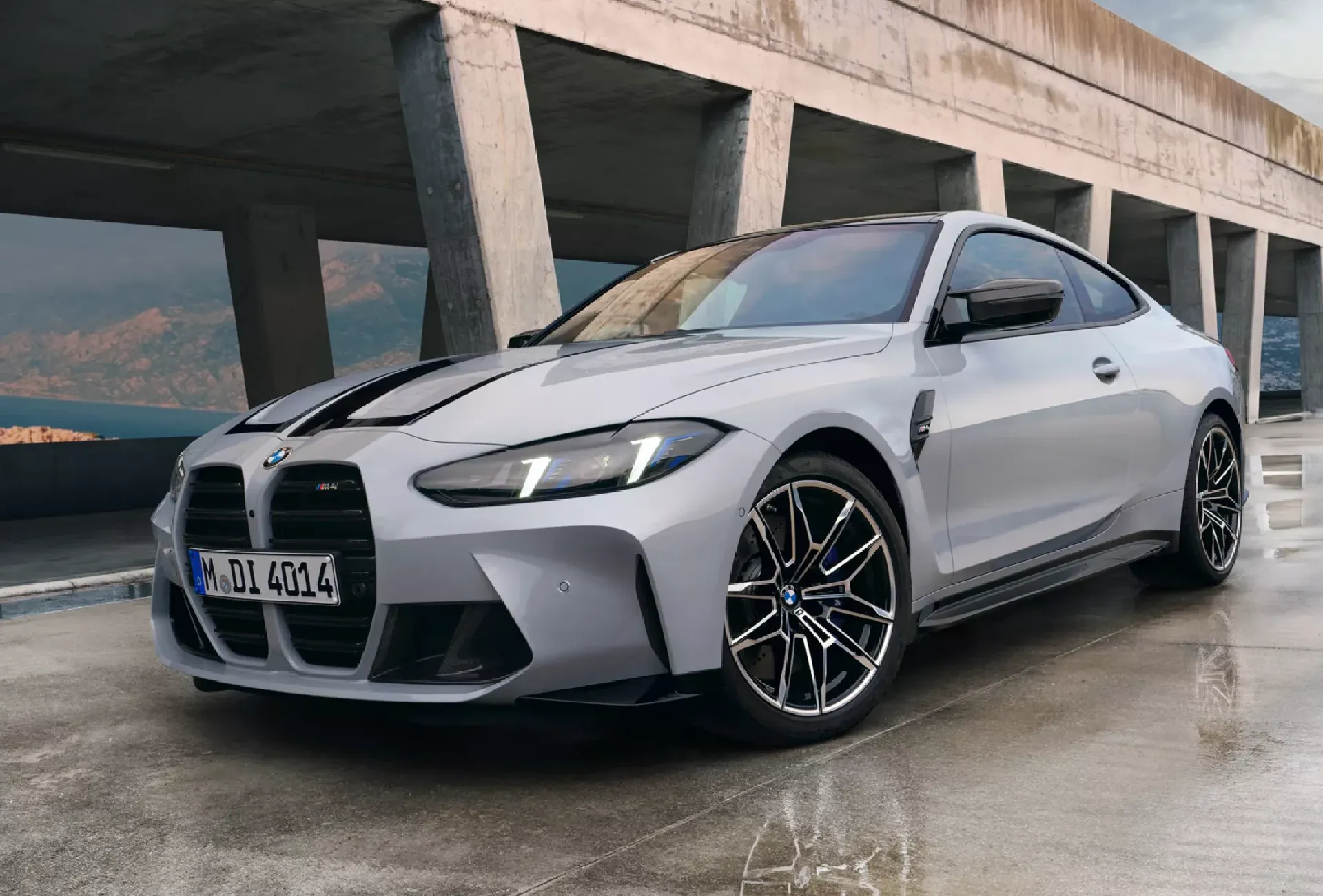 BMW 5 Series sedan being inspected by a technician for the driveshaft recall