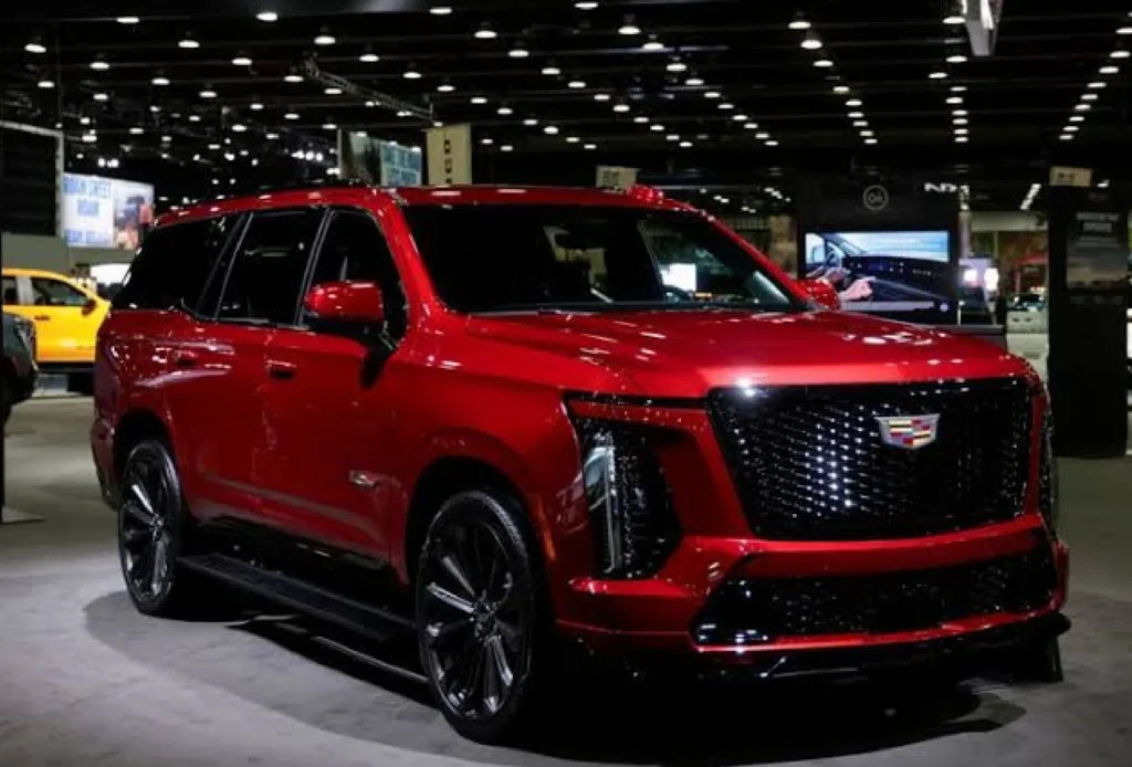 Chevrolet Silverado-style pickup with hood open during engine inspection amid GM V8 recall investigation (1)
