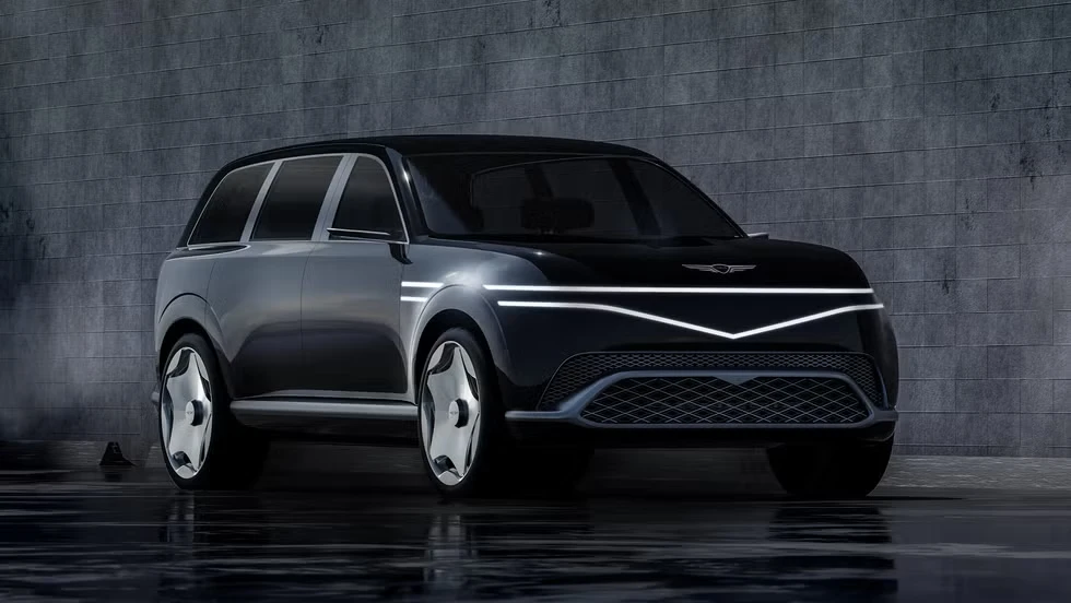 Luxury electric SUV prototype with rear-hinged coach doors open in a showroom GV90 