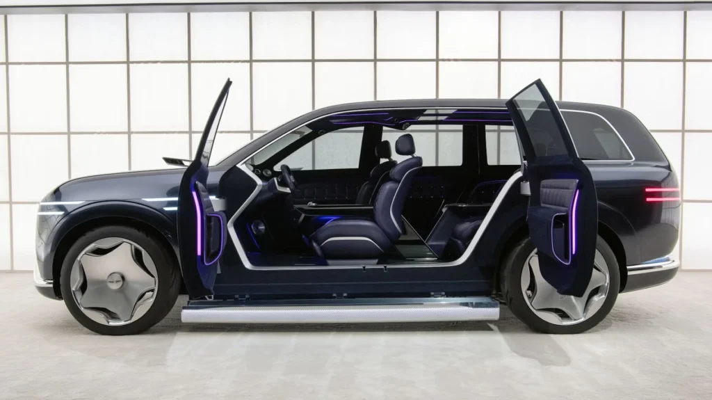 Luxury electric SUV prototype with rear-hinged coach doors open in a showroom GV90 