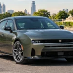 2027 Dodge Charger : Illustration of a muscle car launching at a drag strip