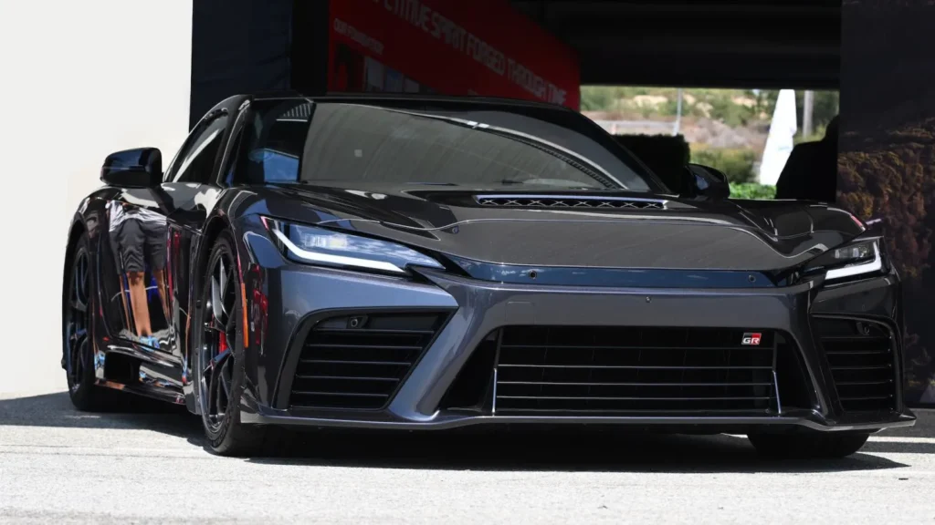 Toyota GR GT hybrid V8 supercar front three-quarter view, AutoAkhbar branded image