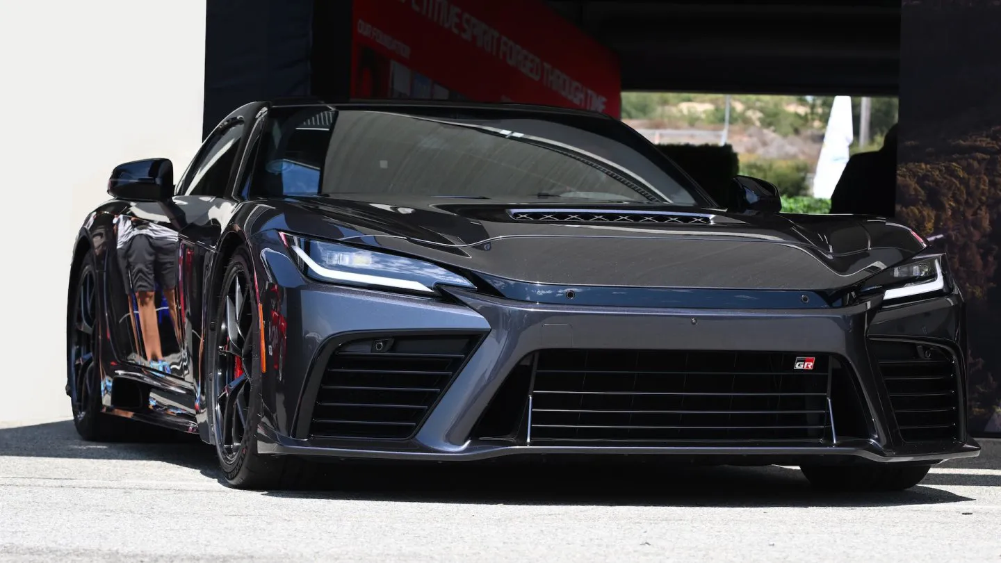Toyota GR GT hybrid V8 supercar front three-quarter view, AutoAkhbar branded image