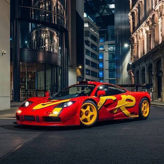 1996 McLaren F1 GTR race car displayed ahead of a classic car auction