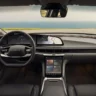 A neat layout matrix displaying pricing eligibility for the Lucid Air UX 3.0 upgrade: 2022 to 2024 requires a nine-hundred-and-fifty-dollar processor hardware upgrade, 2025 and newer receive a free over-the-air update, and 2027 has it as a standard feature