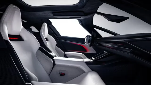 Futuristic ultra-white interior of the next-generation Tesla Roadster prototype featuring sports seats and a minimalist cabin design